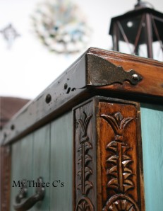 ***SOLD***Turquoise and Dark Stain Distressed Chest. Rich color and beautiful carved detail. Original hardware with soft close hinges.